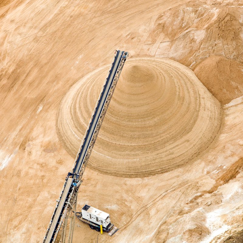 Contractors Resource | Early Branch, SC | Crane hovering over a hill of sand